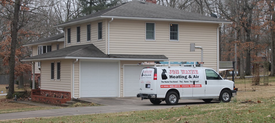 Jon Wayne Heating & Air AC repair van in Springfield, MO neighborhood