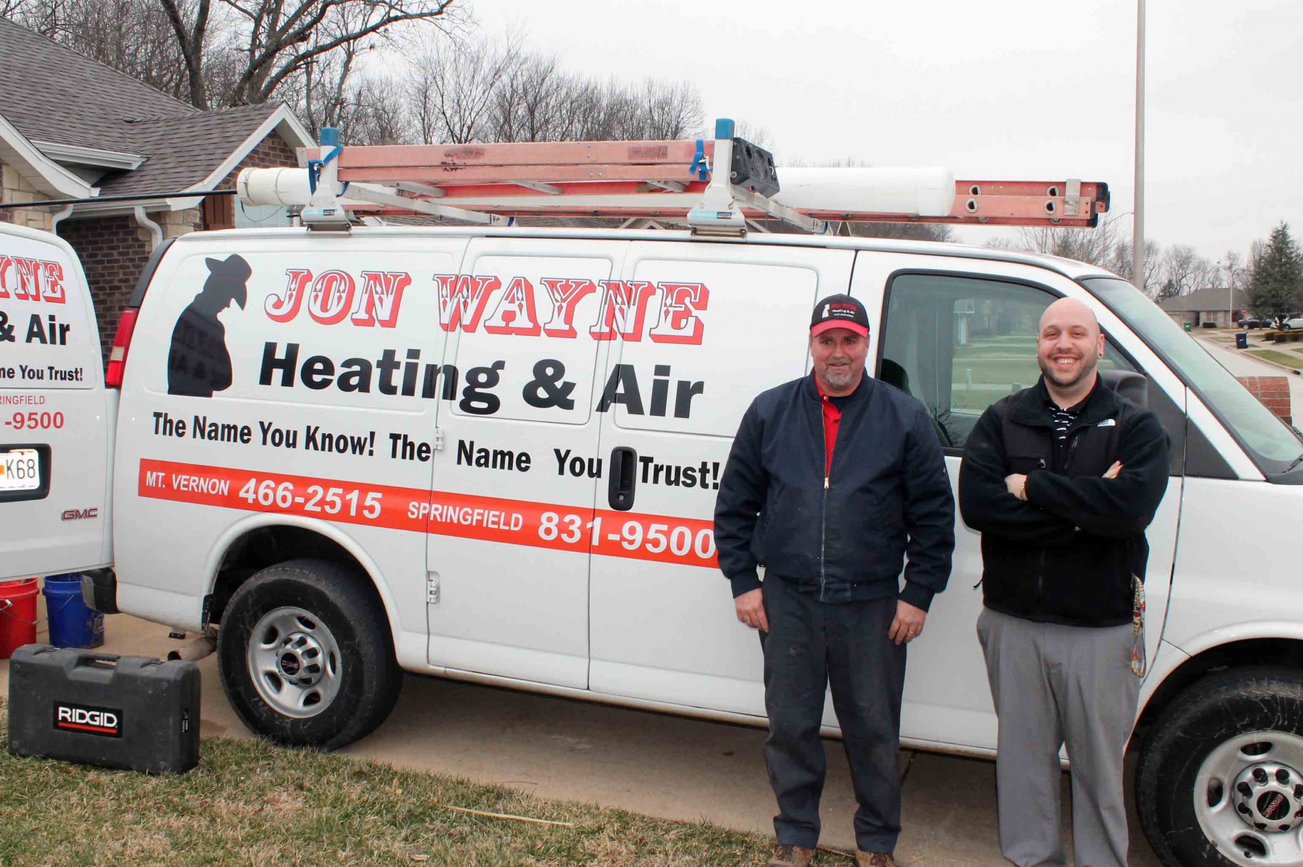 Jon Wayne co-owner and tech in front of HVAC van in Mt Vernon