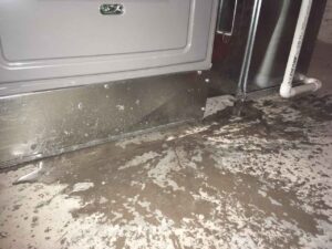 Water that has leaked at the bottom of the furnace in a basement