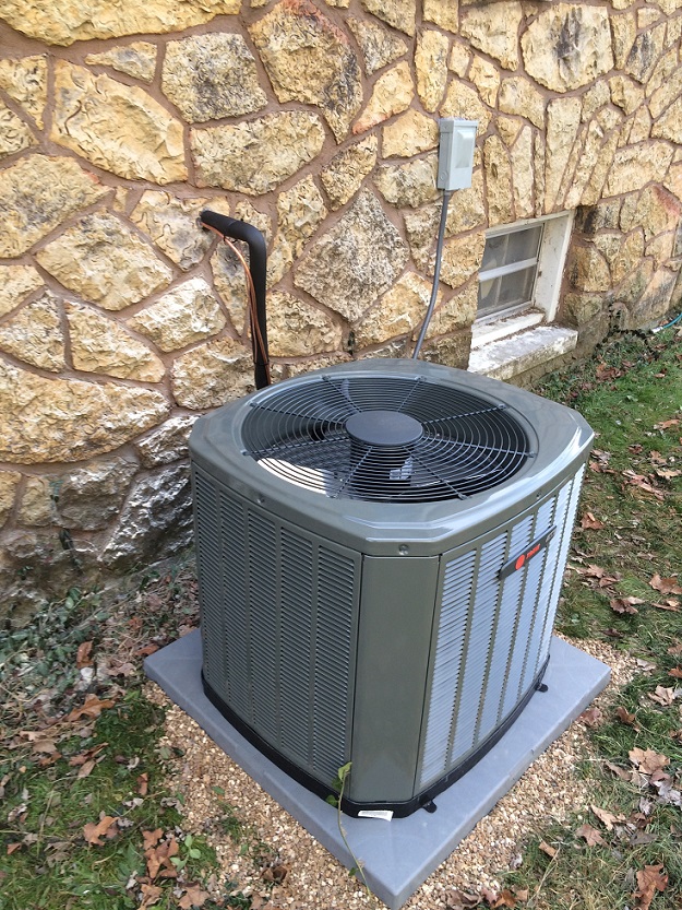 AC unit serviced by Jon Wayne Heating & Air at a home in Springfield, Missouri, making sure to have the proper ac size for your space