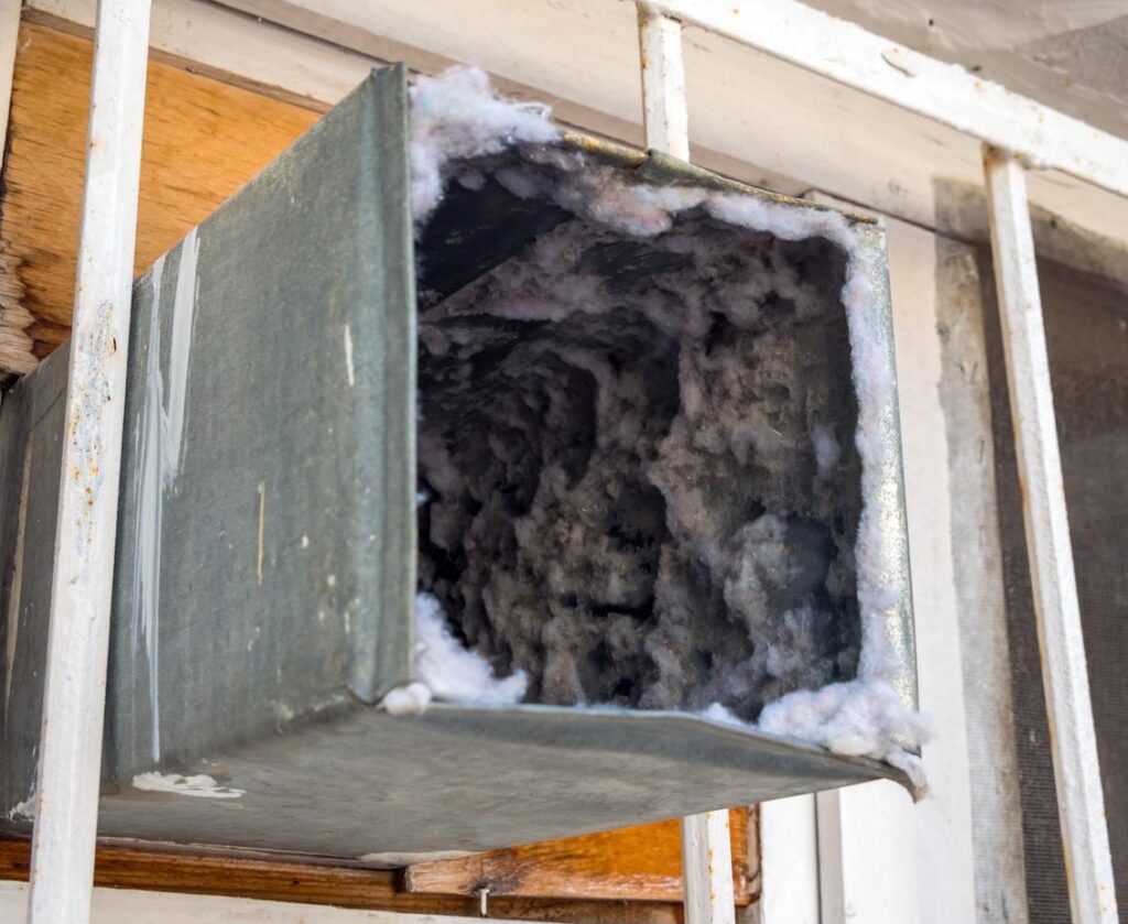 An old air duct filled with dust and dirt