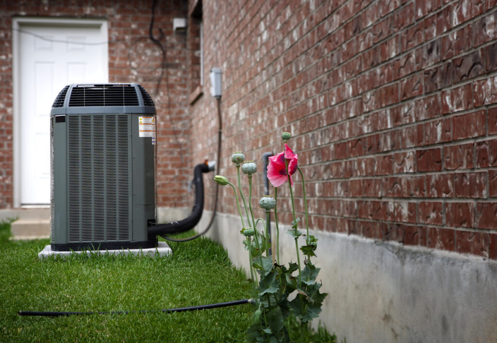 A new outdoor air conditioner in a backyard